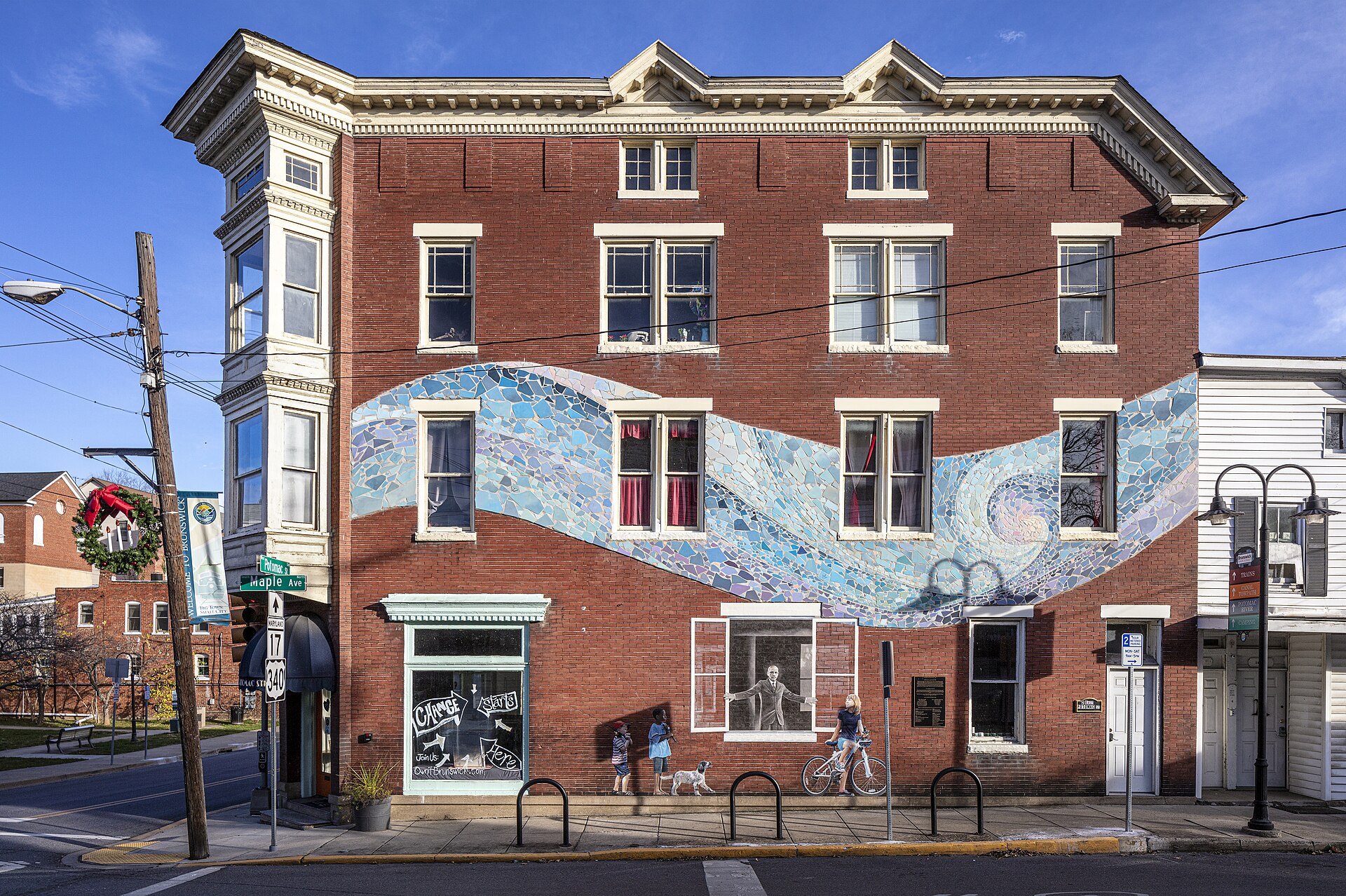 Historic brick building with a mosaic mural on Potomac Street in downtown Brunswick